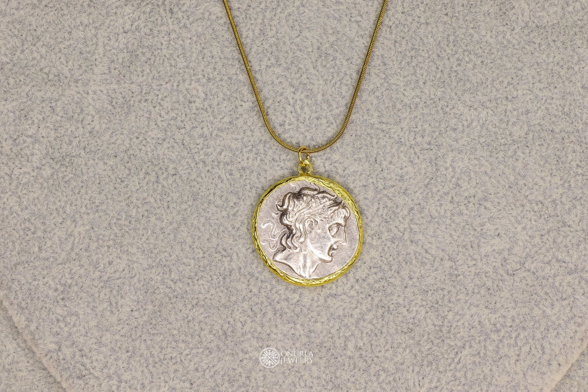 Onurla men's large Alexander the Great profile coin pendant necklace with gold frame and snake chain.