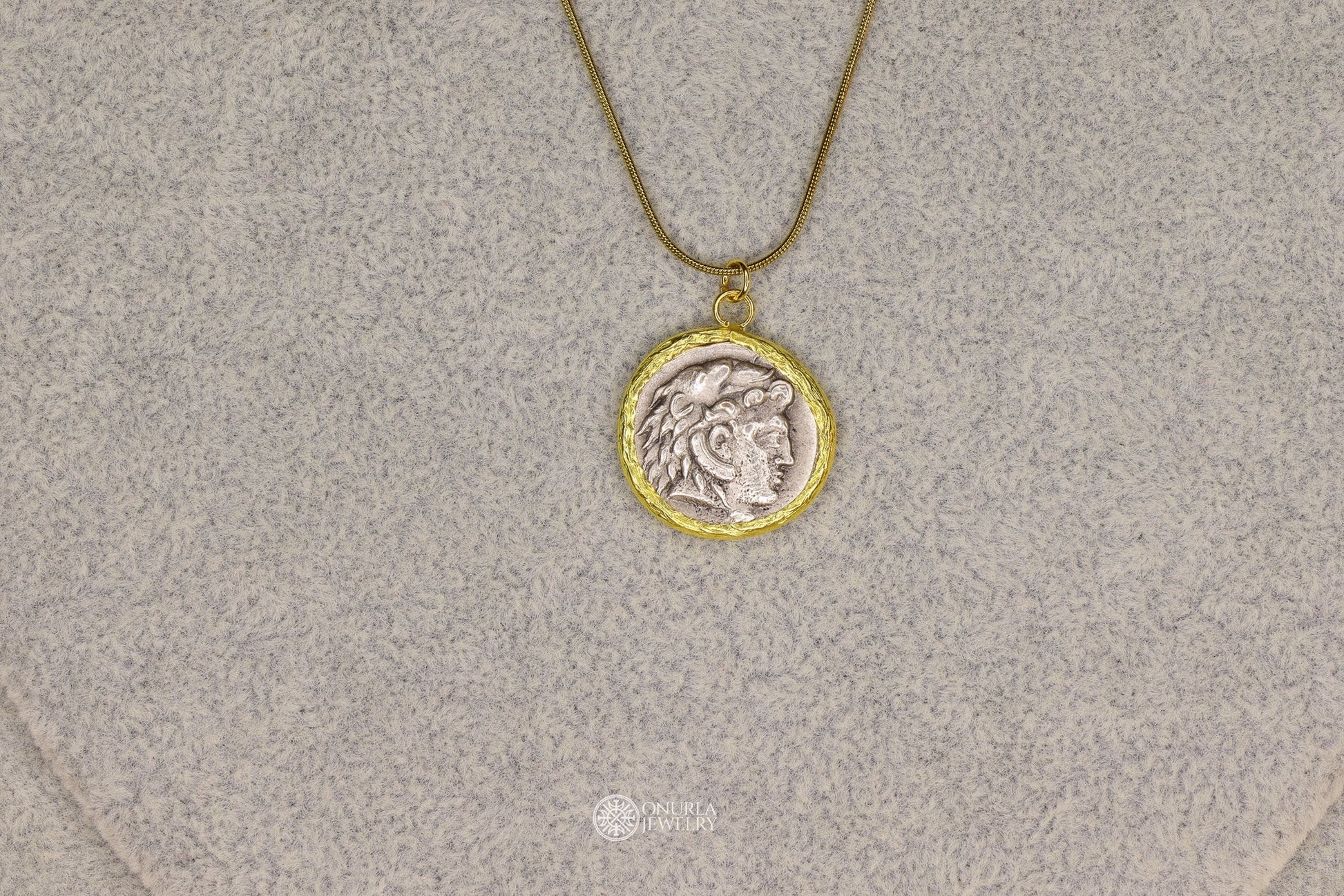 Onurla men's silver-tone pendant necklace with Alexander the Great relief on a gold-tone snake chain.