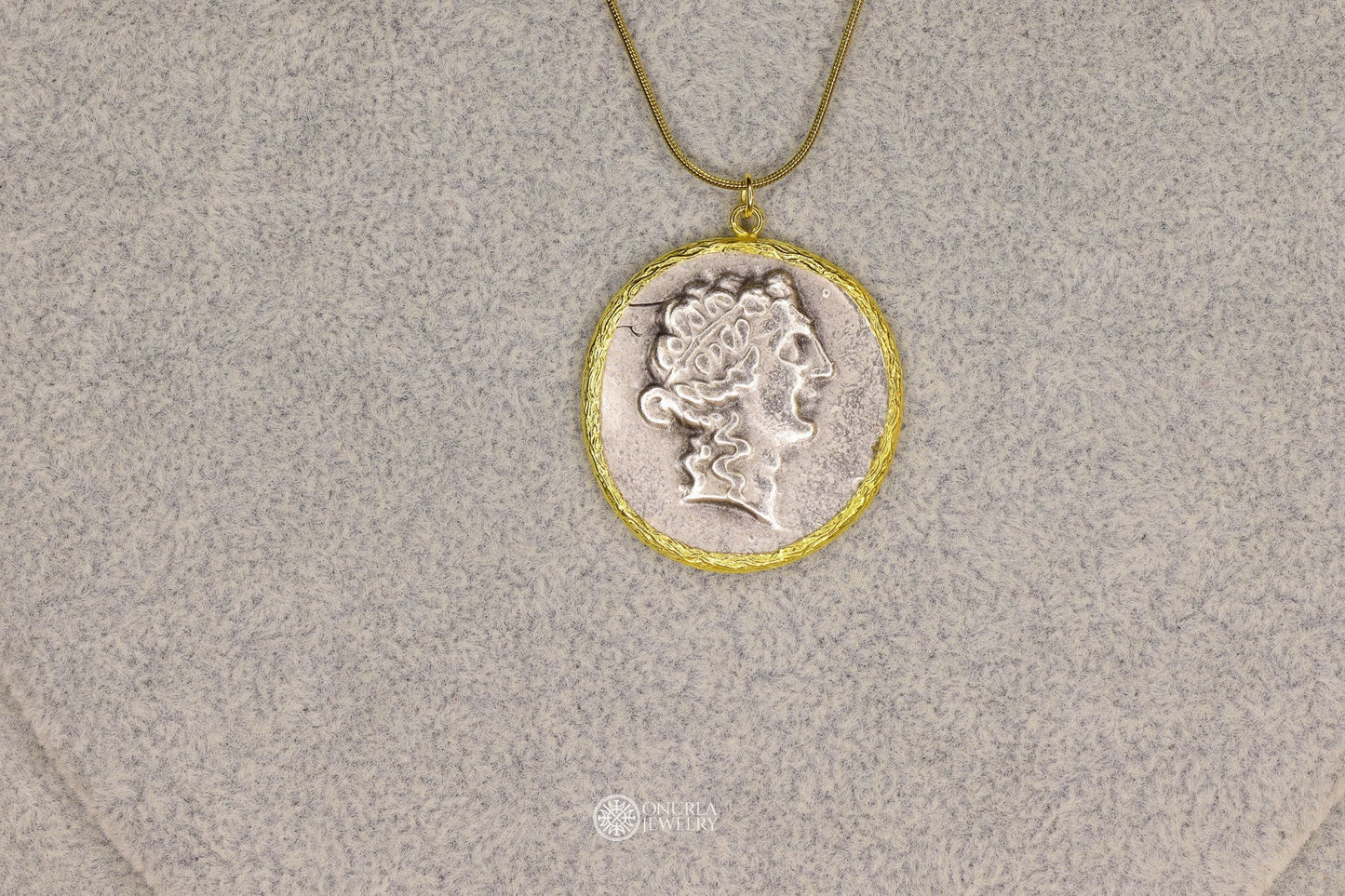 Onurla men's silver-tone ancient Greek profile coin pendant with gold frame and chain. Laurel wreath detail.