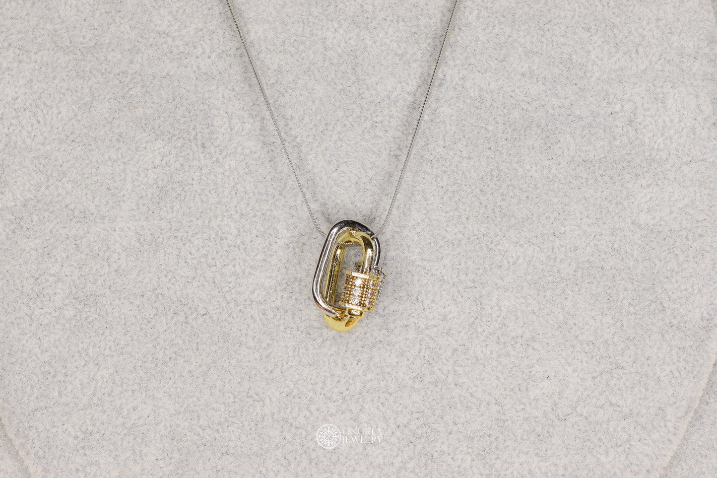 Onurla men's two-tone carabiner lock pendant necklace with stone details on a thin snake chain.